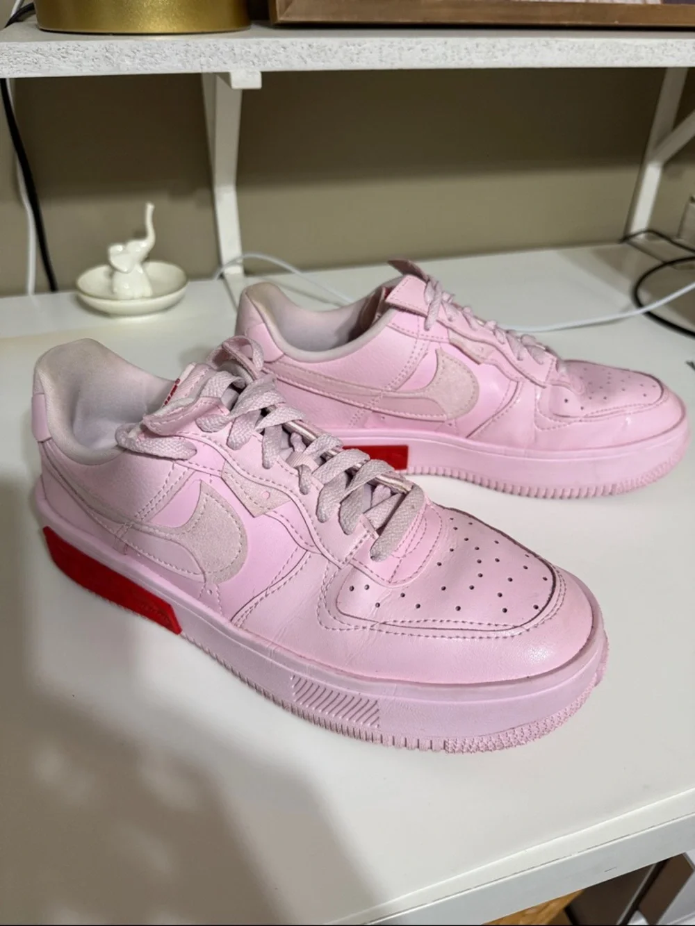 Nike Women’s Pink Low-Top Sneakers with Red Accent